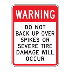 Warning Do Not Back Up Over Spikes Or Severe Tire Damage Will Occur Sign