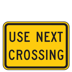 Use Next Crossing Advance Warning Plaques